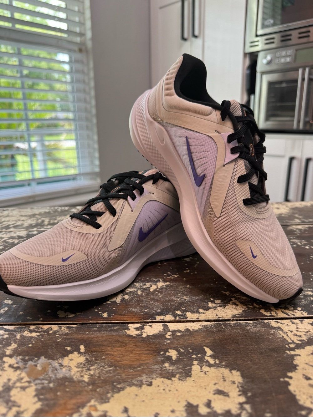 Nike Women's Pale Pink Running Shoes with Purple Swoosh